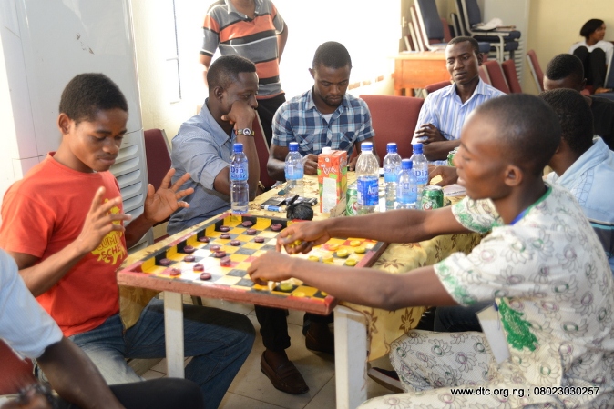 Some members playing the game of draft during the Zonal Family Weekend